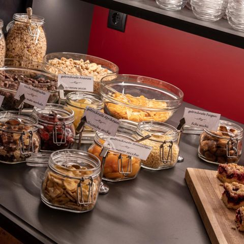 Cereals, dried fruits, and cakes at the breakfast buffet