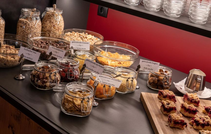 Cereals, dried fruits, and cakes at the breakfast buffet