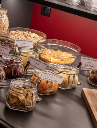 Cereals, dried fruits, and cakes at the breakfast buffet