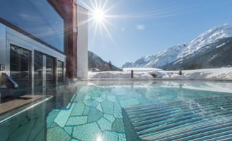 Our hotel with pool in Toblach in winter