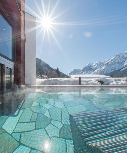 Our hotel with pool in Toblach in winter